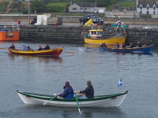 Helmsdale and Coigach skiffs racing in background Wick photo